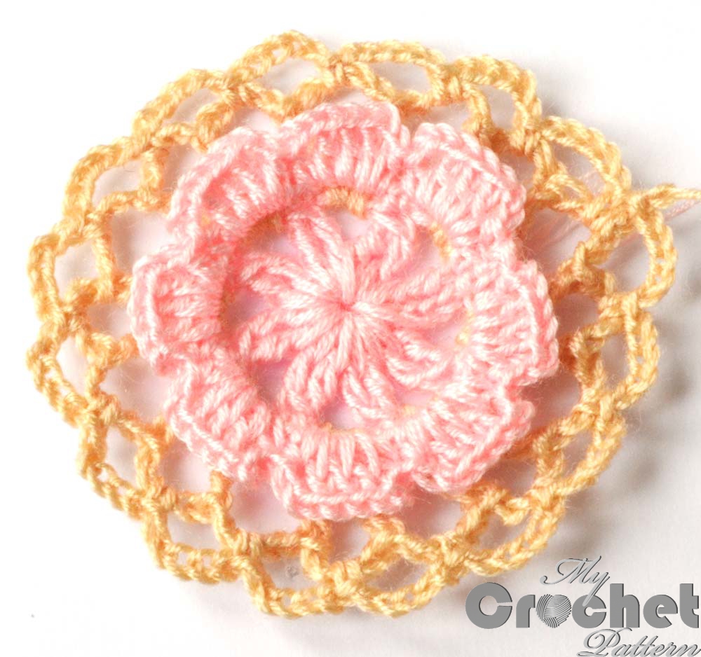 Round crochet motif with flower in the center