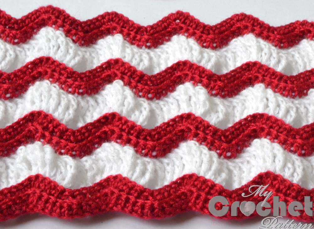 Crocheted vintage afghan pattern with red and white stripes photo