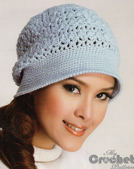 blue delicate crochet hat on a girl big photo