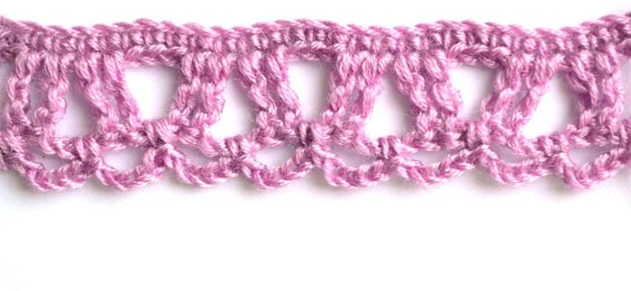 Purple crochet edging pattern with arches