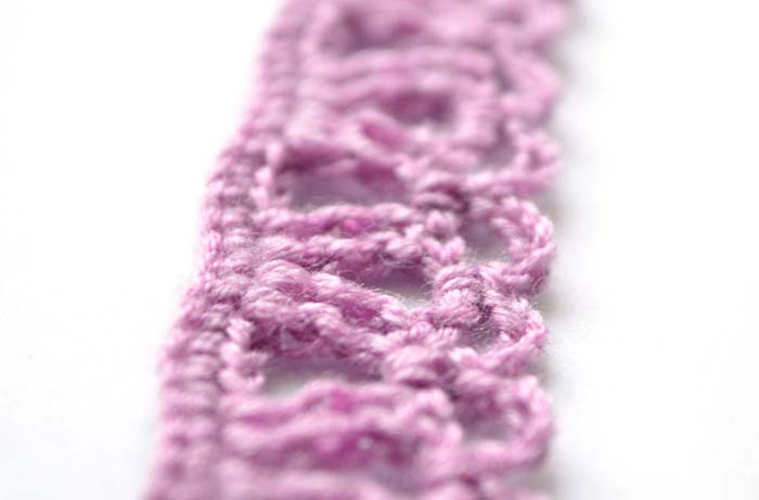Purple crochet edging pattern with arches